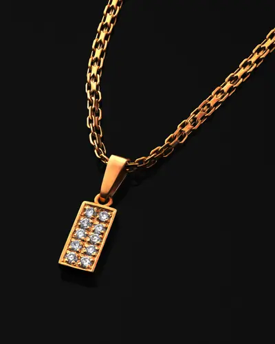 A rectangular pavé diamond bar pendant on a box chain, on a black ground